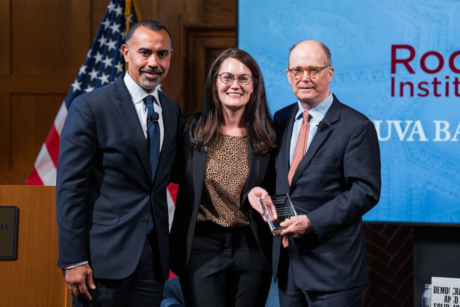 UVA Batten Dean Ian Solomon and Rodel Fellowship Executive Director Lizzy McCourt Noonan present 2025 Edwards Book Award to Professor James Davison Hunter.